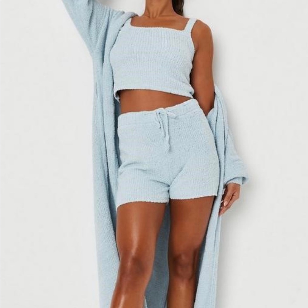 a pair of fluffy knit booty shorts featuring an elasticated tie waist.